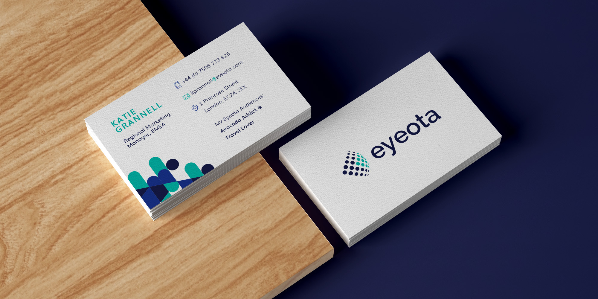 Eyeota business card front and back shown from above