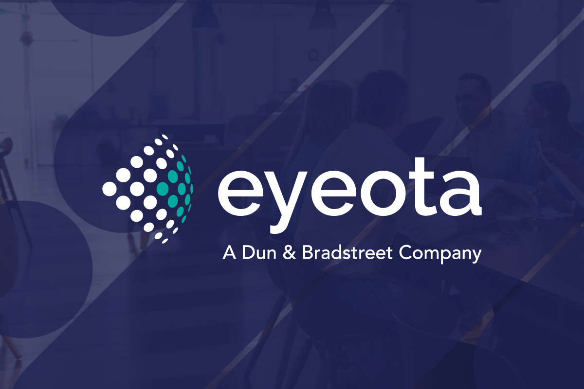 Eyeota logo on background image of people meeting at table