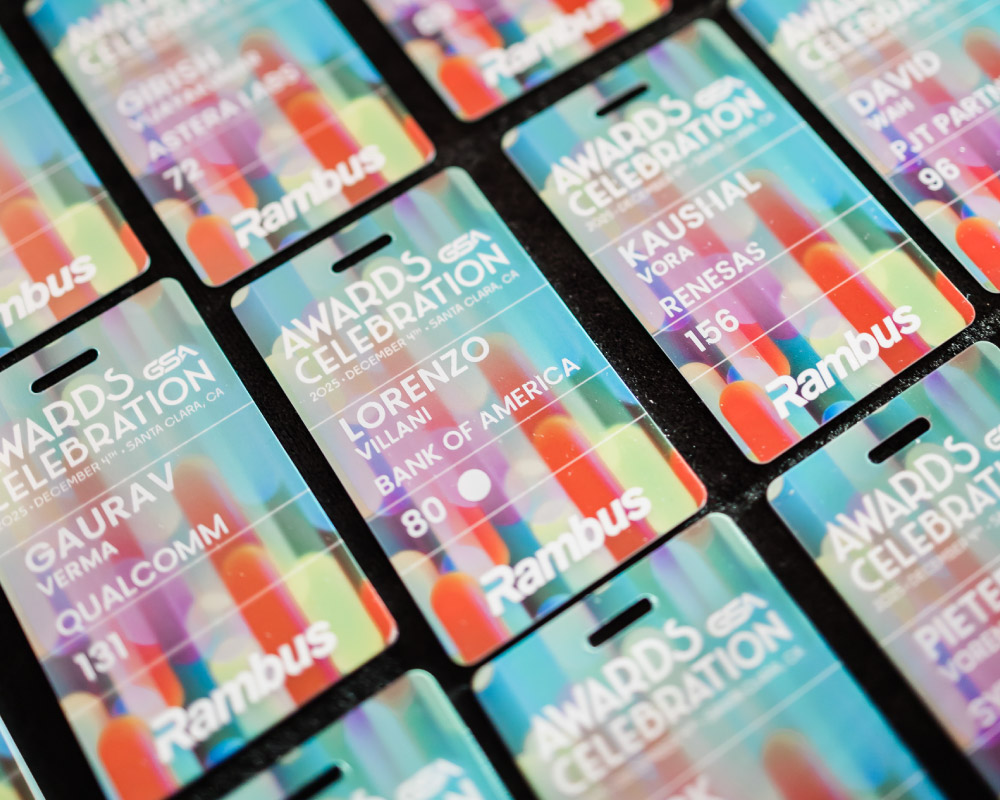 A number of badges featuring the 2025 GSA Awards Celebration branding laying on a table