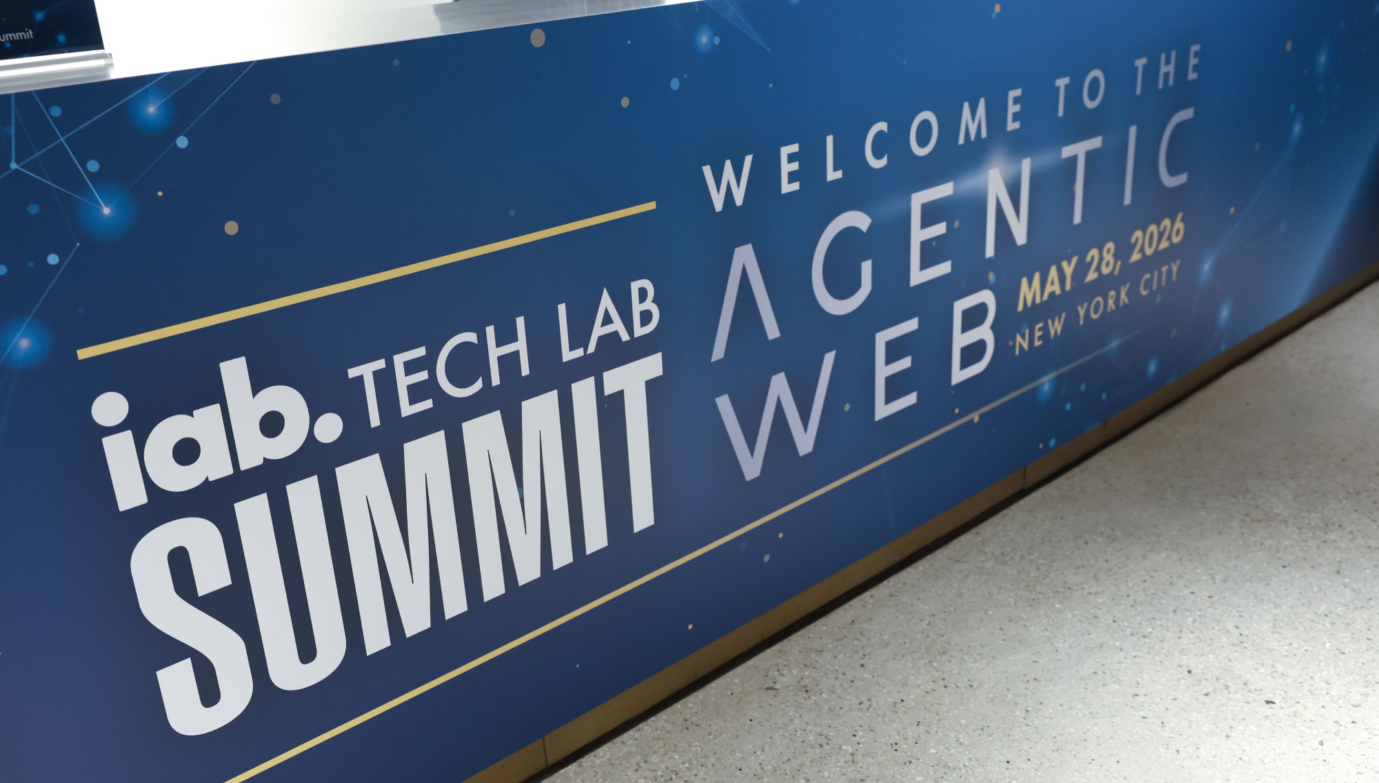 Registration desk containing IAB Tech Lab Summit Agentic Web branding