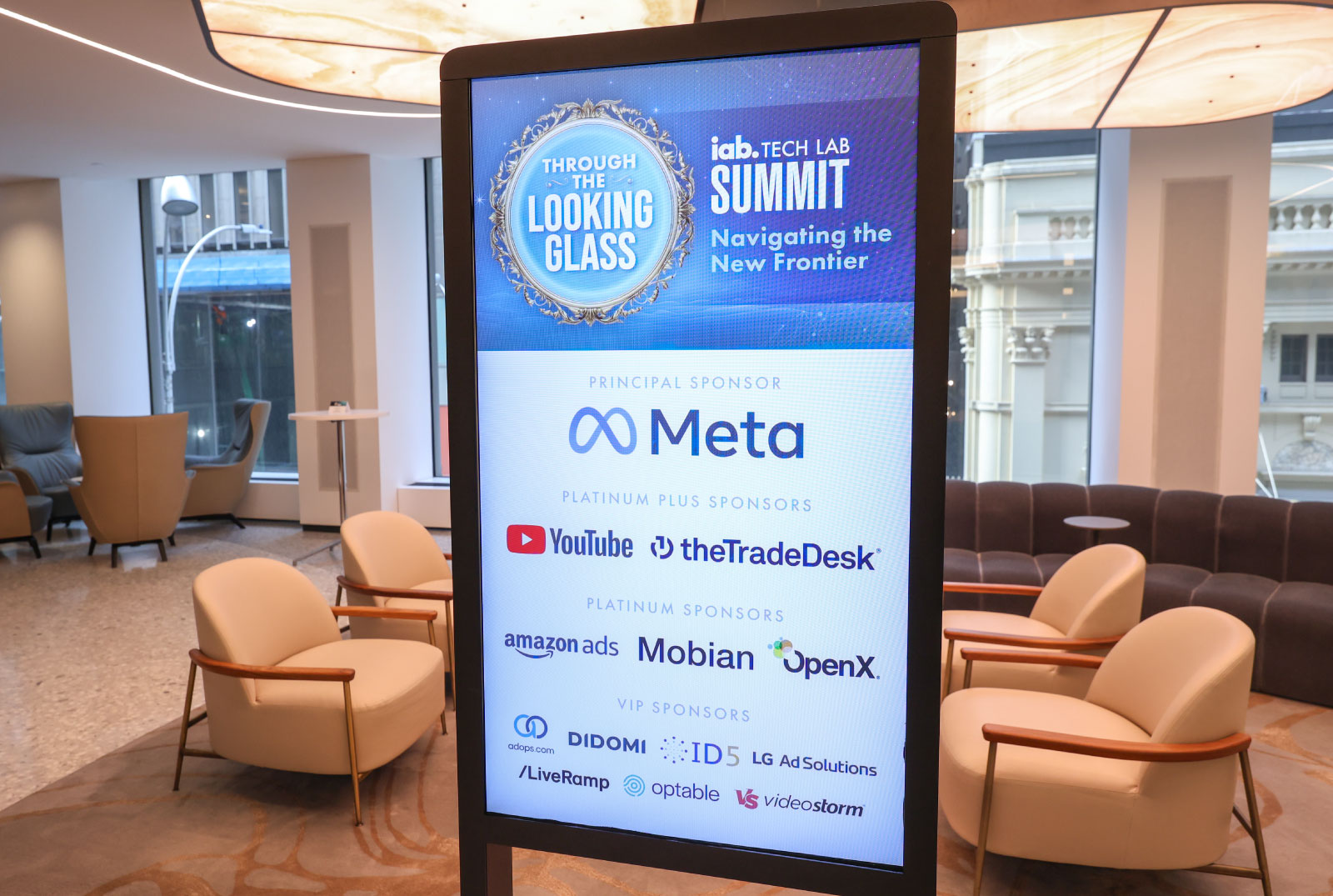 Conference hall lobby with IAB Tech Lab Summit sponsor sign