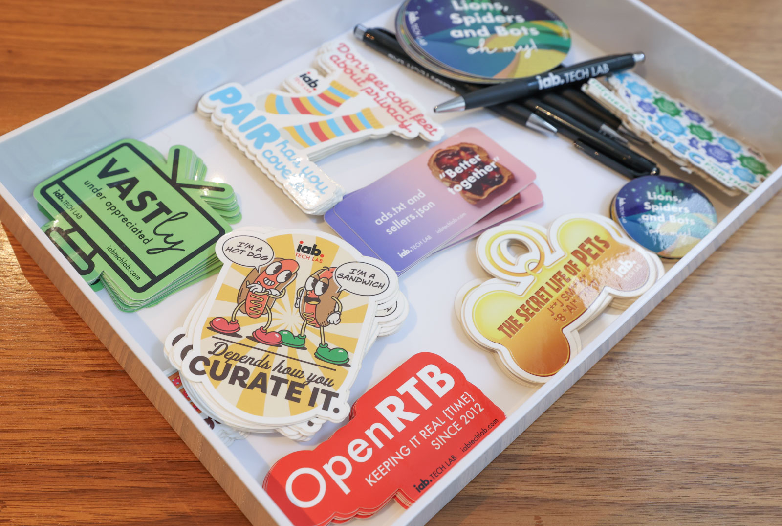Tray of IAB stickers on a table