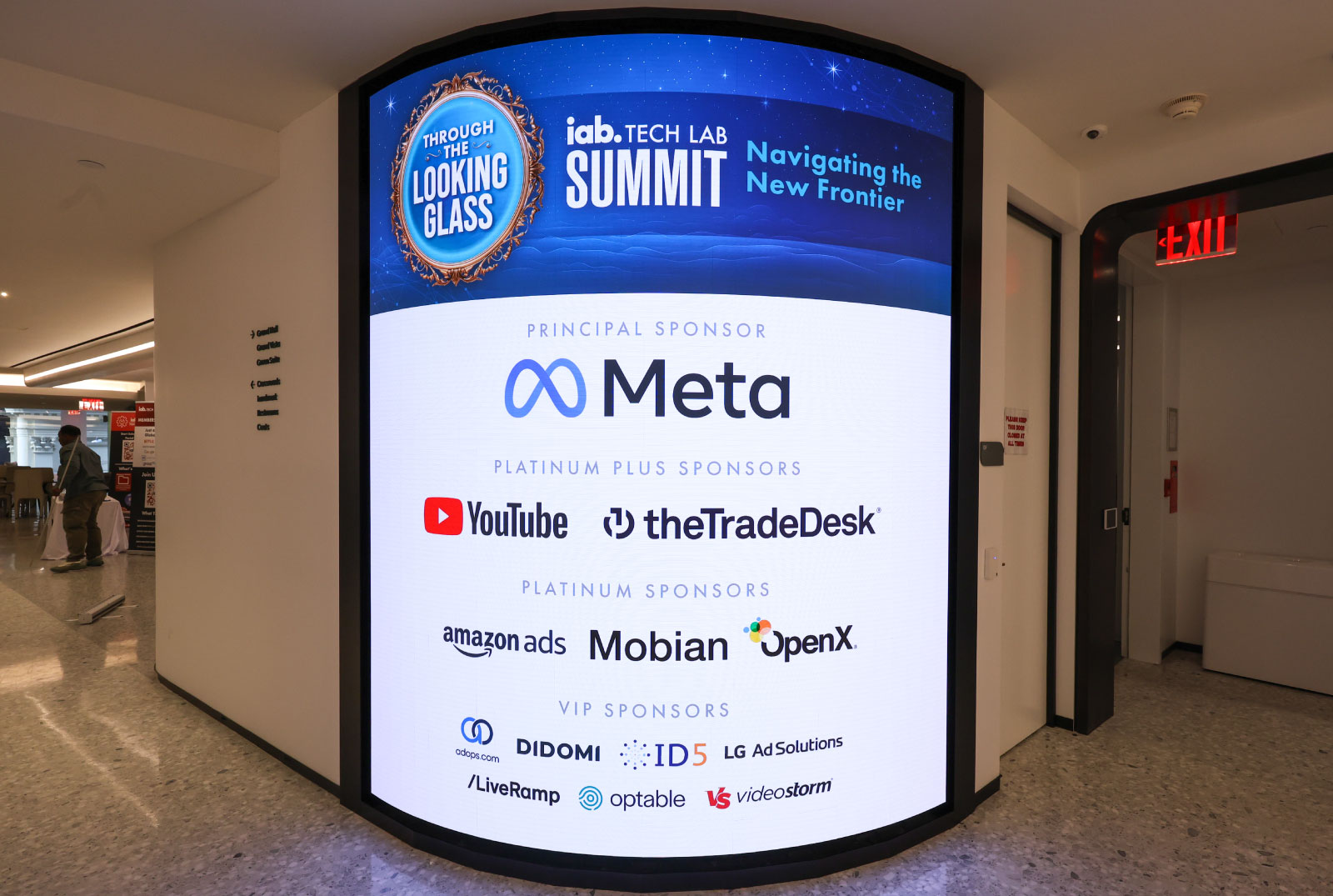 Conference hall lobby with IAB Tech Lab Summit sponsor sign
